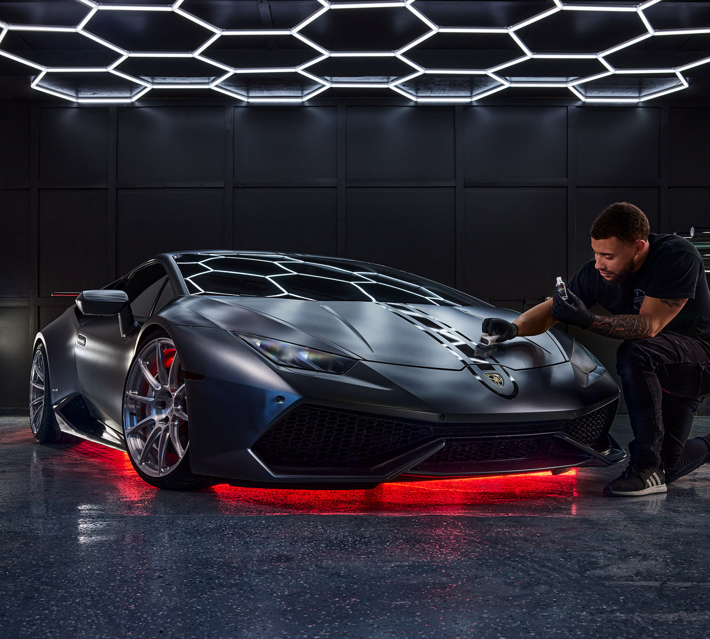 
                  
                    Man Cleaning an expensive car using the Stoner Professional Grade Paint Ceramic Coating 30ml
                  
                